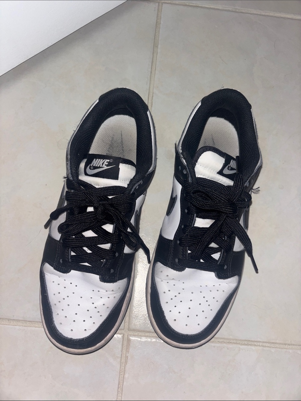 Nike Kids Black and White Low-Top Sneakers with Classic Swoosh